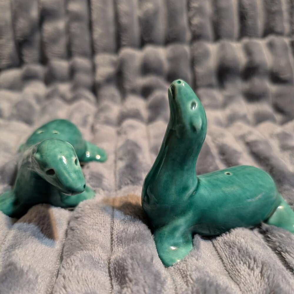 Ceramic Seal figurines of stylized animals in green glaze
